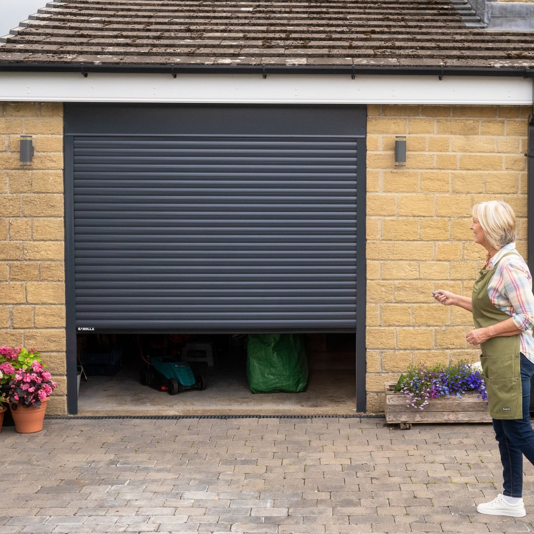 Elderly homeowner uses her Garolla Transform Pro garage door